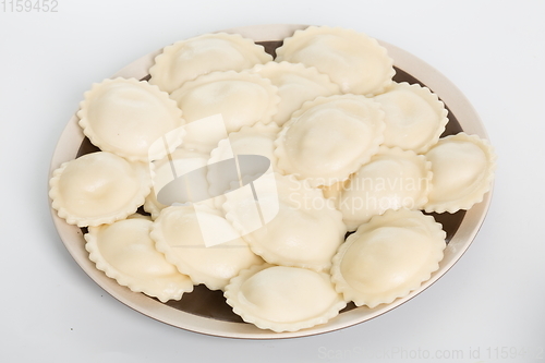 Image of Vareniki or dumplings, pierogi before boiling - traditional Ukrainian food