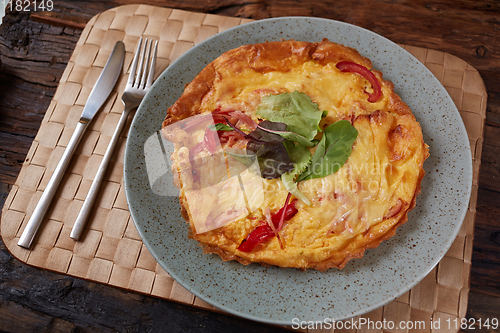Image of Omelet with green onion on wood table. Fresh ingredient of egg and onion. Delicious dish. Easy to cook. Popular in Thailand food. Still life food.