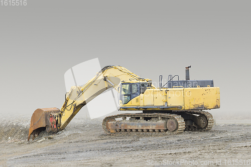 Image of Excavator in rocky ambiance