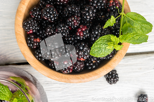 Image of Wooden cup with Blackberries