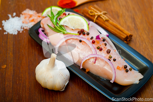 Image of fresh organic chicken breast with herbs and spices