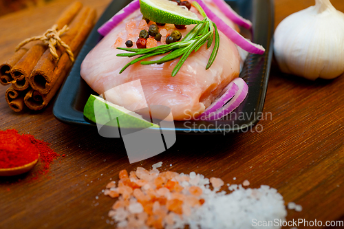 Image of fresh organic chicken breast with herbs and spices