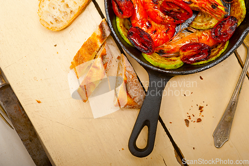 Image of roasted shrimps with zucchini and tomatoes