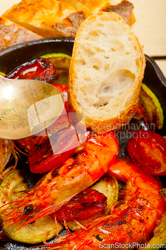 Image of roasted shrimps with zucchini and tomatoes