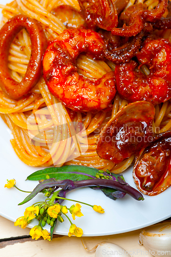 Image of Italian seafood spaghetti pasta on red tomato sauce