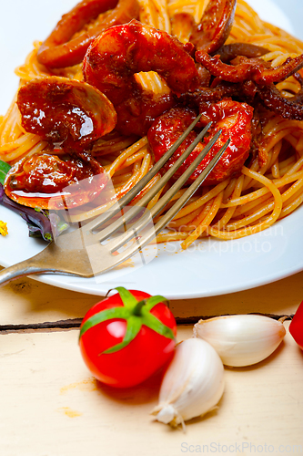 Image of Italian seafood spaghetti pasta on red tomato sauce