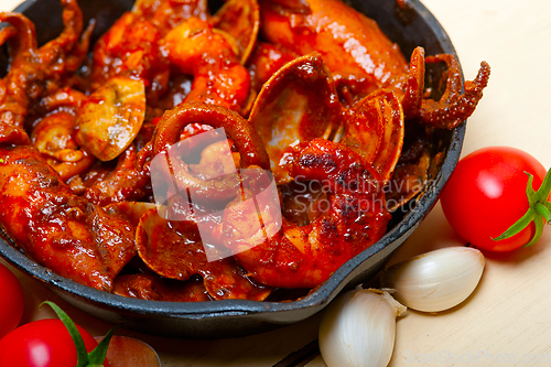 Image of fresh seafoos stew on an iron skillet