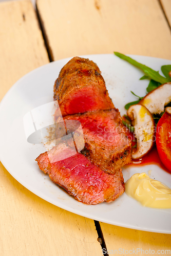 Image of beef filet mignon grilled with vegetables