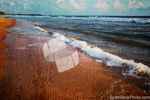 Image of Wave surging on sand