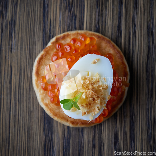 Image of pancake with red caviar 