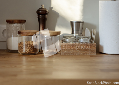 Image of various containers on kitchen table