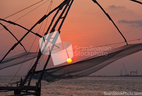 Image of Chinese fishnets on sunset. Kochi, Kerala, India