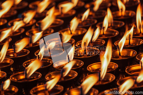 Image of Burning candles in Buddhist temple