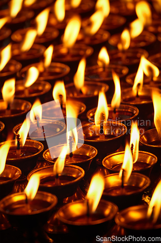 Image of Burning candles in Buddhist temple. Dharamsala, Himachal Pradesh