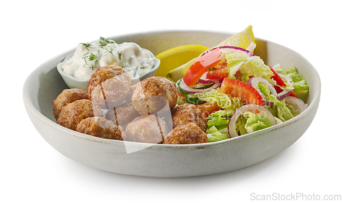 Image of plate of meat balls and vegetable salad