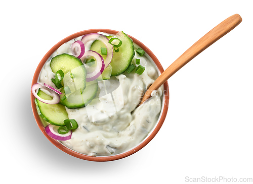 Image of bowl of greek yogurt with cucumber and red onion