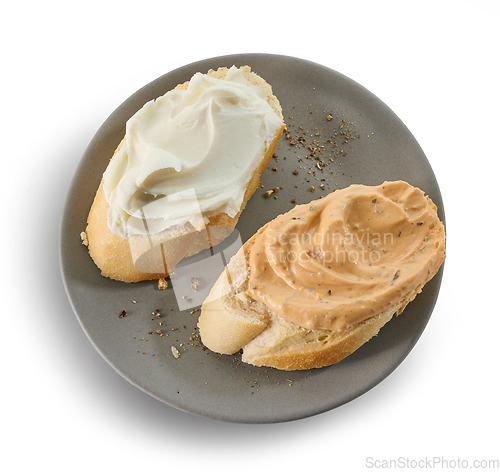 Image of two baguette slices with cream cheese