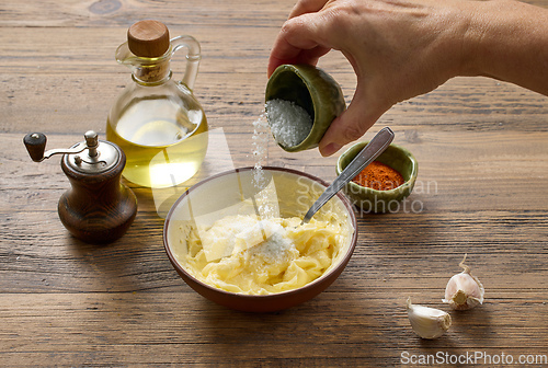 Image of adding salt to whipped butter