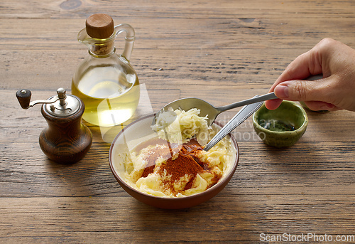 Image of adding grated garlic to butter