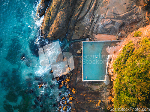 Image of Early morning golden light on the rocks and tidal pool Whale Bea