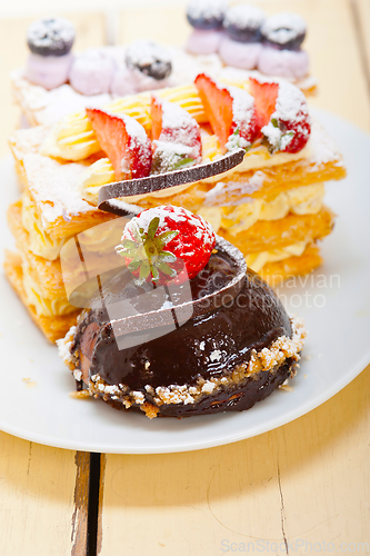 Image of selection of fresh cream cake dessert plate