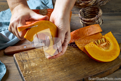 Image of peeling fresh pumpkin