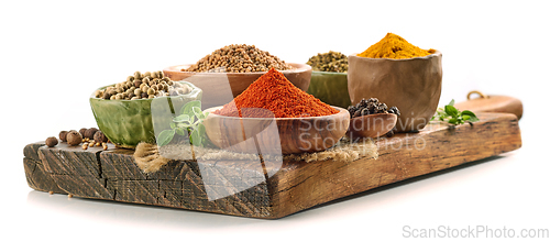 Image of various spices on wooden board