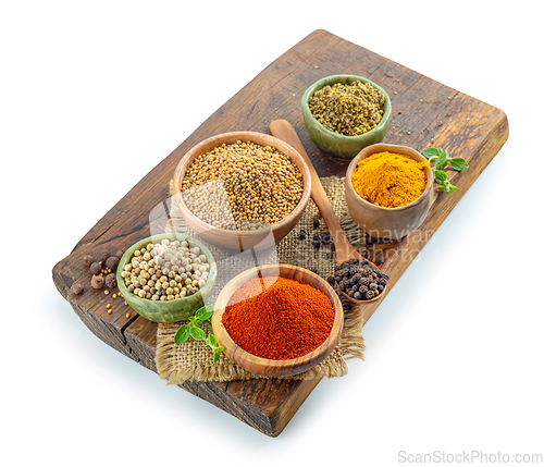 Image of various spices on wooden board