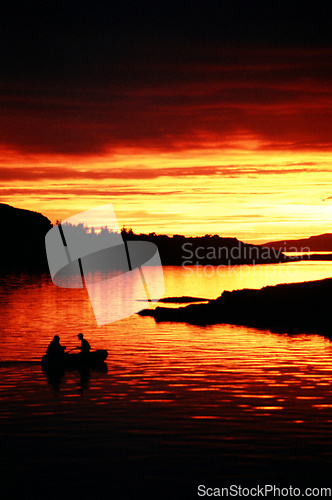 Image of Fishermen on lake outdoors.