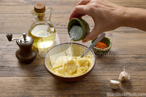 Image of adding salt to whipped butter
