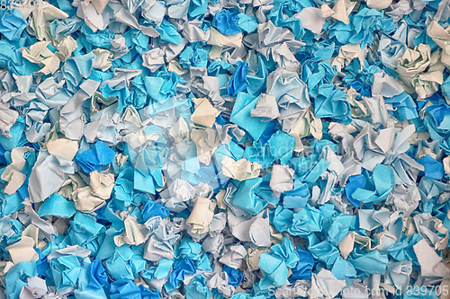 Image of blue and white damaged papers