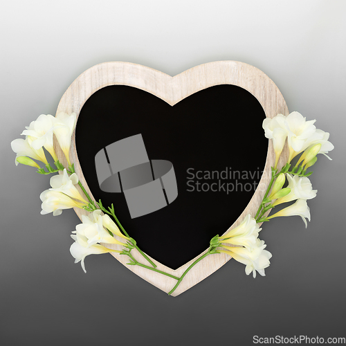 Image of Heart Shape Chalkboard Frame with Freesia Flowers