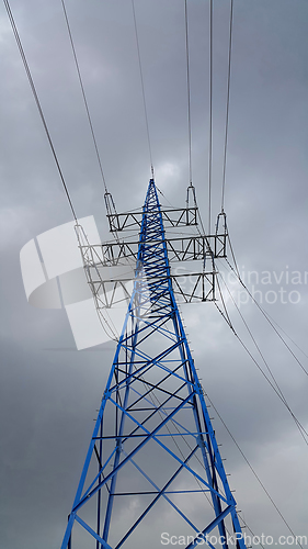 Image of High voltage tower against the cloudy sky