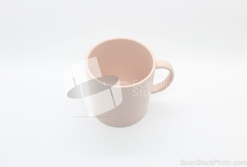 Image of Empty pink mug isolated on white background