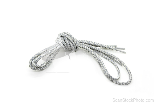 Image of New shoelaces tied in a knot isolated on white background