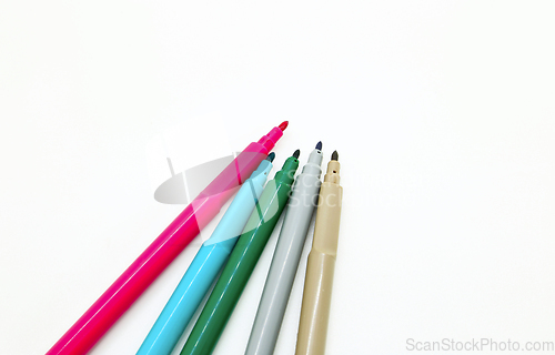 Image of Bright multicolored markers isolated on a white background 