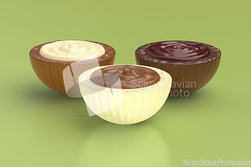 Image of Different chocolate candies on green background