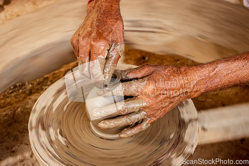 Image of Potter at work makes ceramic dishes. India, Rajasthan.