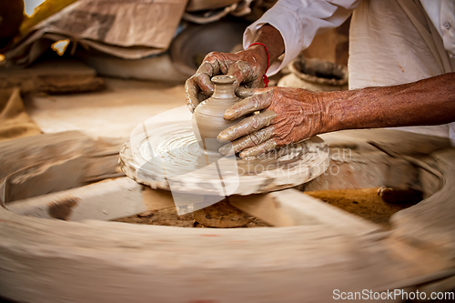 Image of Potter at work makes ceramic dishes. India, Rajasthan.