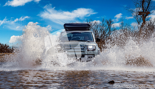 Image of Off road tourist car rides off-road in the highlands. Expedition