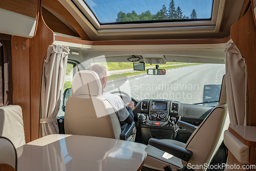 Image of Man driving on a road in the Camper Van RV