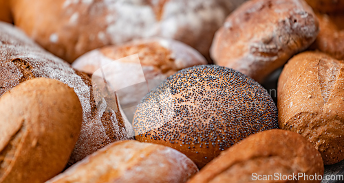 Image of Freshly baked natural bread is on the kitchen table.