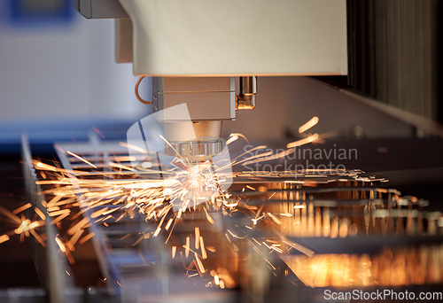 Image of CNC Laser cutting of metal, modern industrial technology.