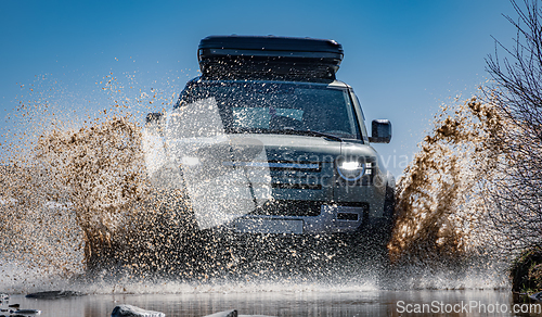 Image of Off road tourist car rides off-road in the highlands. Expedition