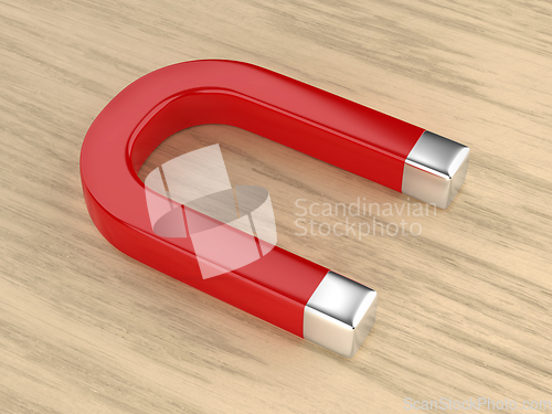 Image of Horseshoe magnet on wooden desk