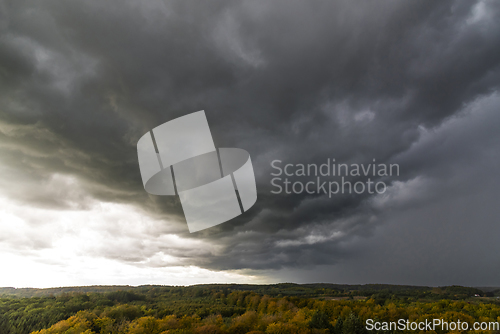 Image of Storm clouds over the forest