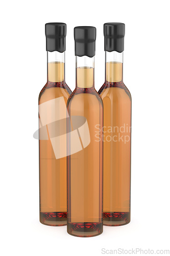 Image of Three glass bottles with whisky