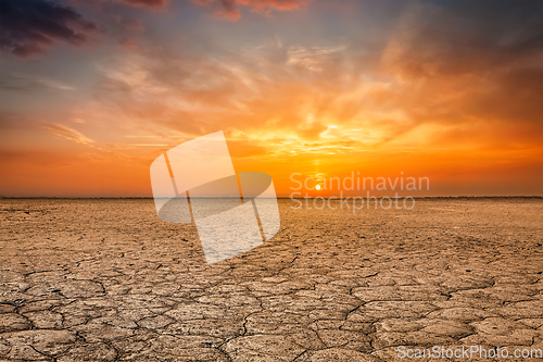 Image of Cracked earth soil sunset landscape