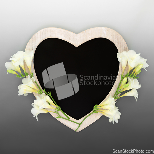 Image of Heart Shape Chalkboard Frame with Freesia Flowers