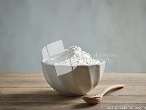 Image of bowl of flour on wooden kitchen table